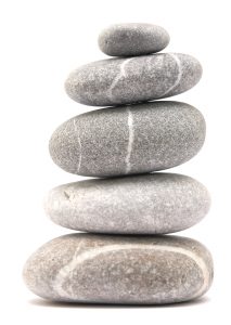 Tame Your Triggers. balancing stone tower isolated on a white background